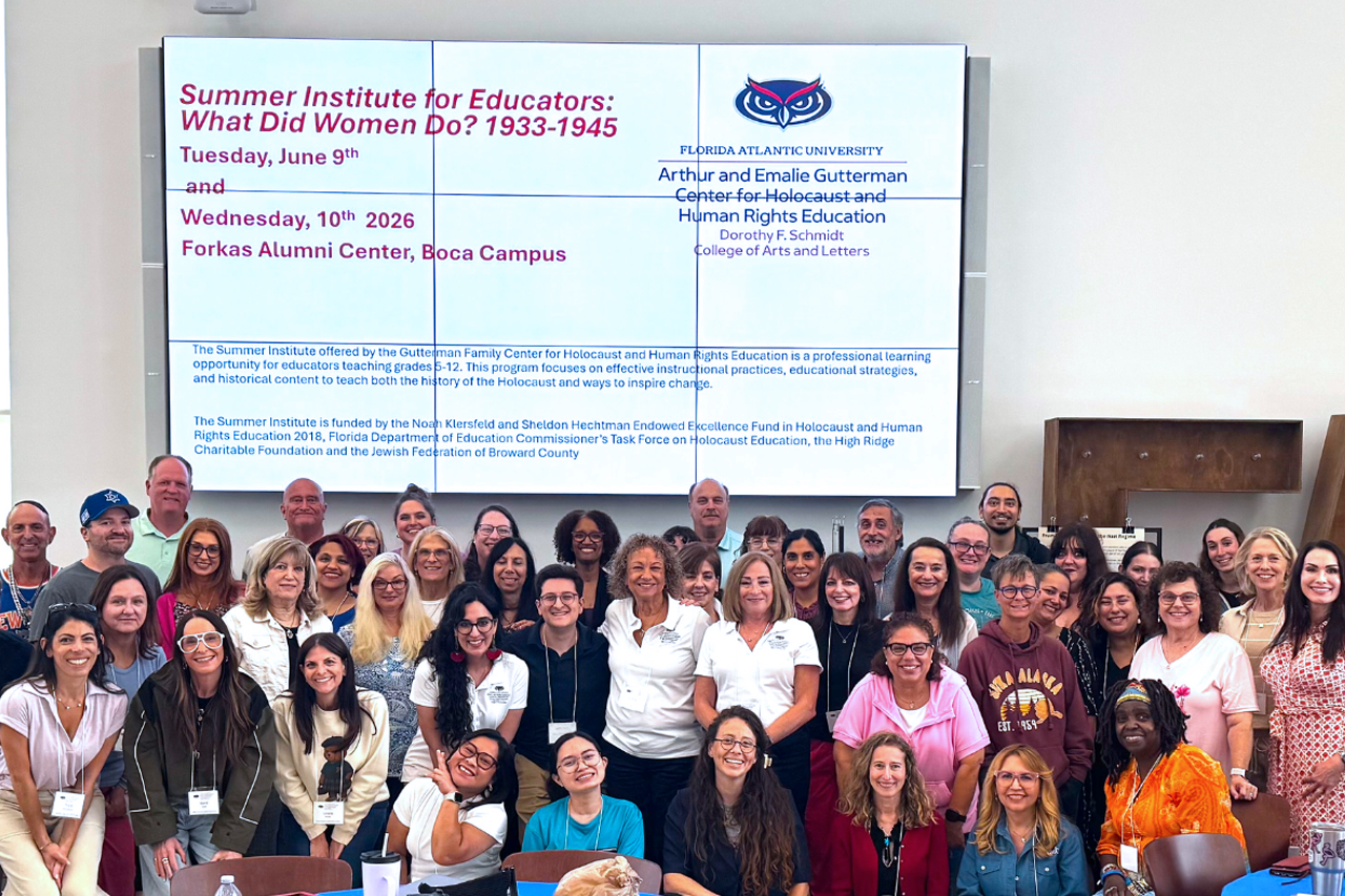 group of educators in a room smiling