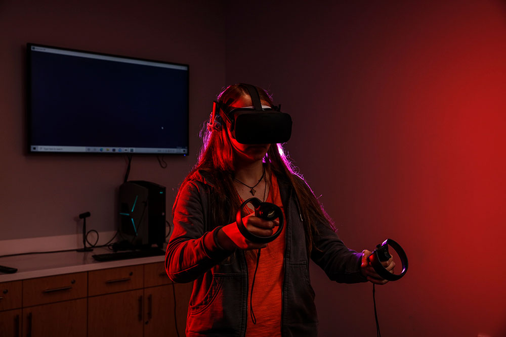 student using virtual reality equipment