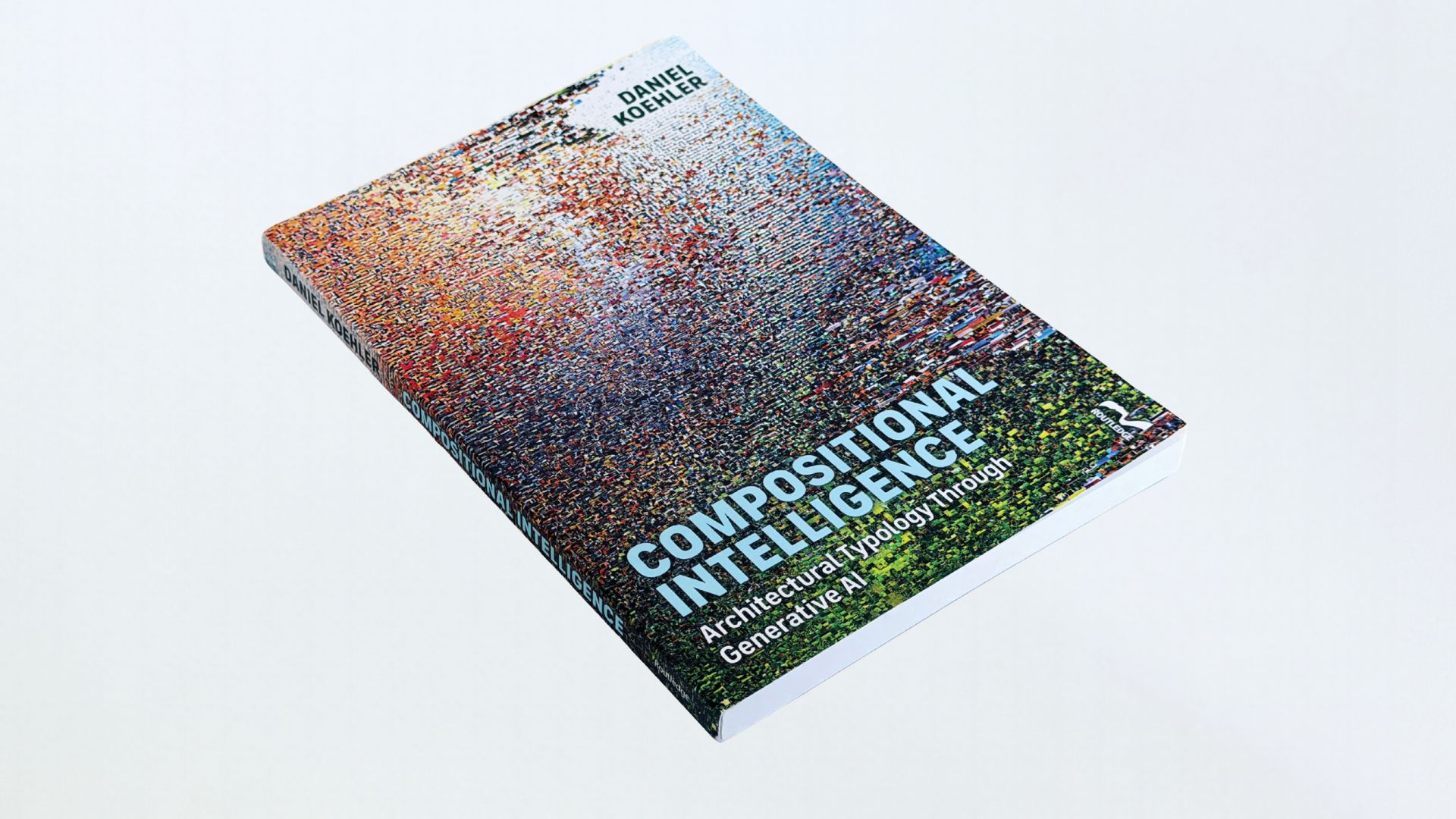A paperback copy of Daniel Koehler's book, Compositional Intelligence: Architectural Typology through Generative AI, rests diagonally on a white surface. Its cover features a dense, multicolored abstract digital pattern with the title in large white lettering.