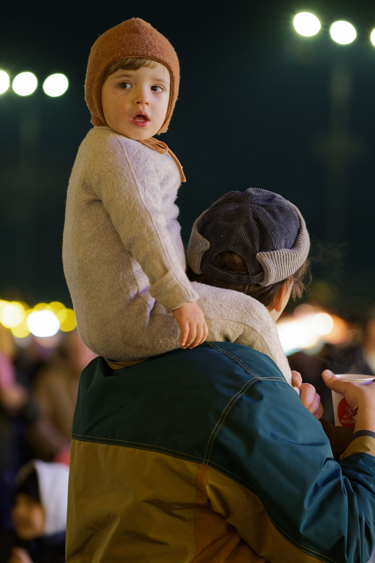 child on dad's shoulders