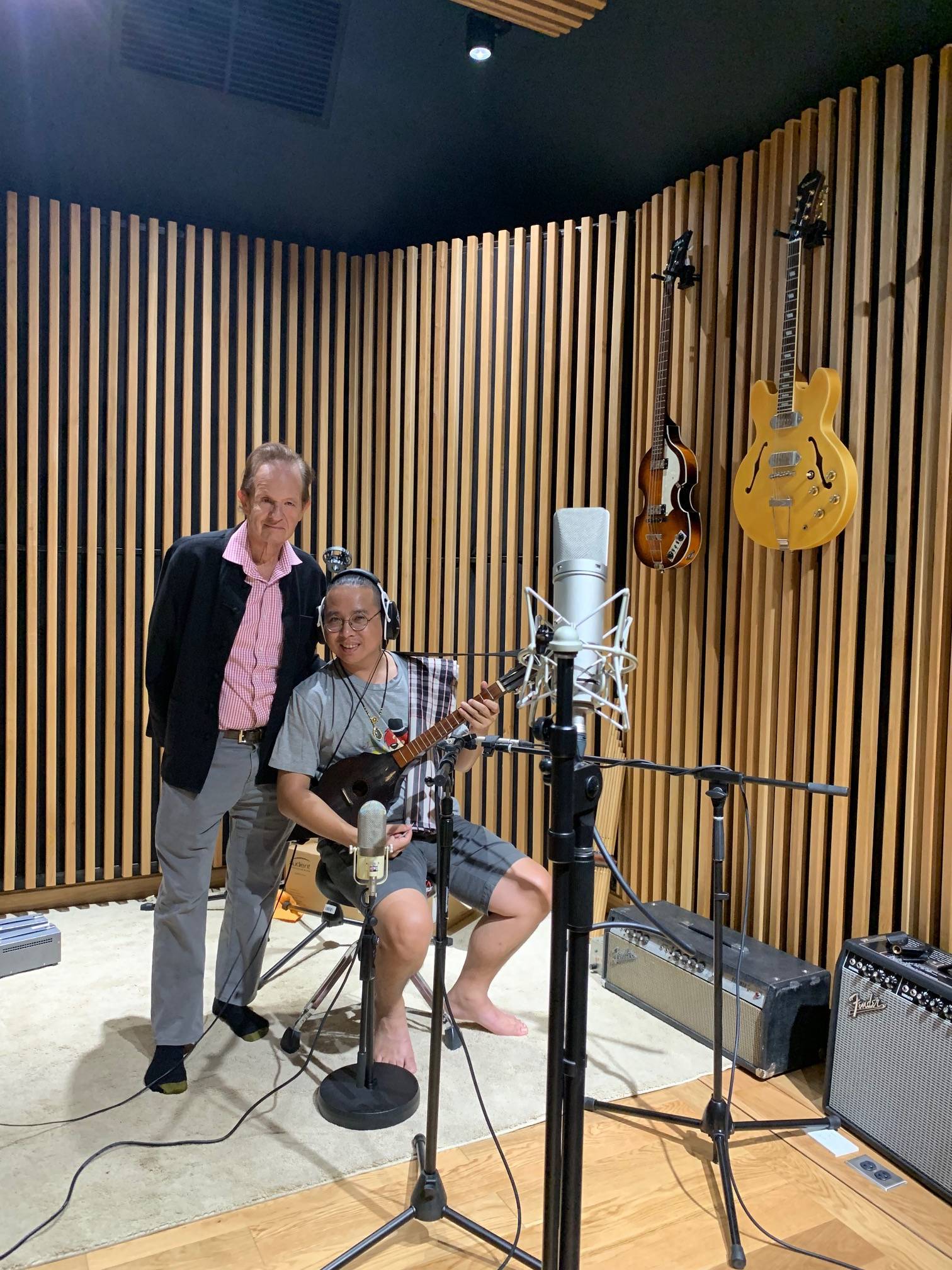 Zager with Student holding guitar