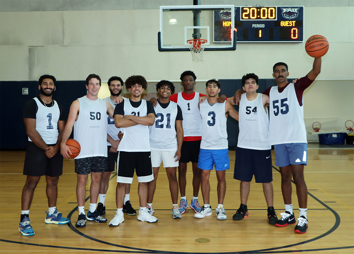 A group of basketball student players on the court