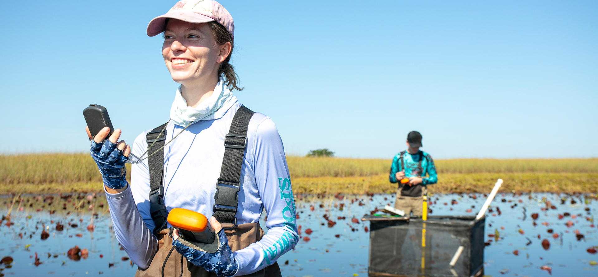 Two people in a swamp