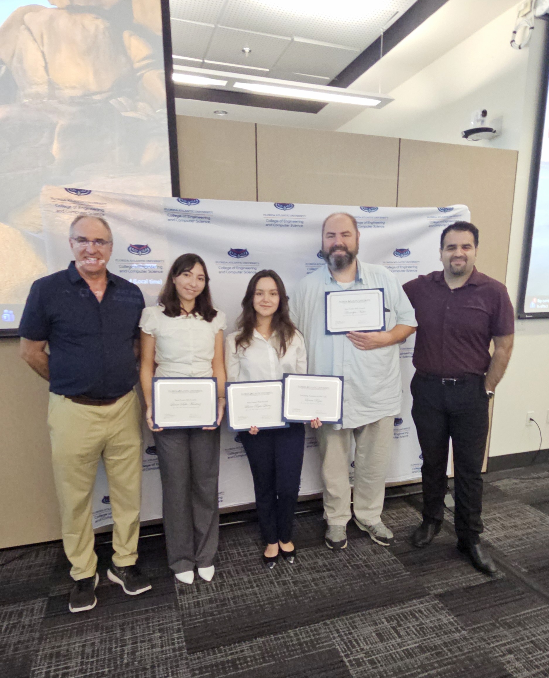 Image of graduate students who won awards.