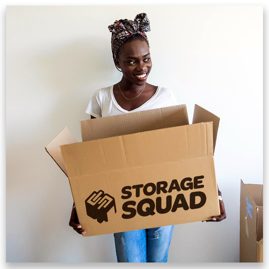 student holding a storage squad box