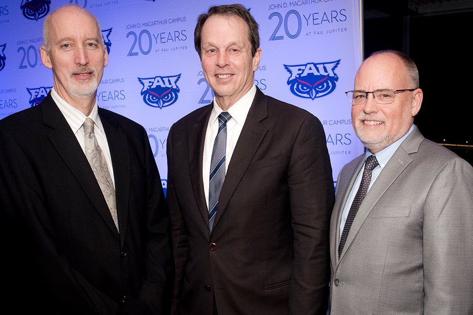 From left to right, Jeffrey Morton, FAU Distinguished Teacher of the Year; FAU President John Kelly; Tim Steigenga, interim dean, FAU Harriet L. Wilkes Honors College.