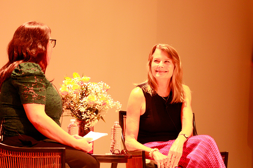 Jennifer Egan, seated, smiles at event facilitator Rachel Luria, also seated