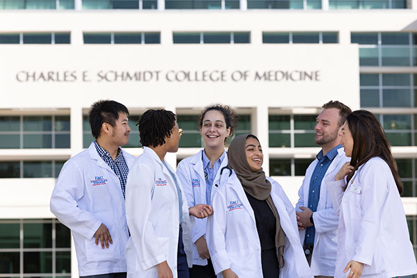 Group of FAU medical students outside the Schmidt College of Medicine building