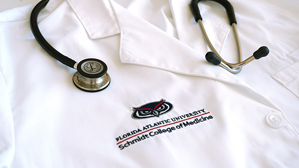 FAU Schmidt College of Medicine white coat with stethoscope