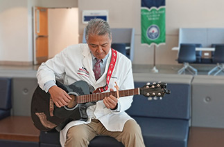 Richard D. Shih, M.D. playing the guitar