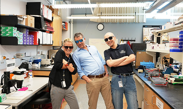 Drs. Kantorow and Brennan with Research Team posing with sunglasses