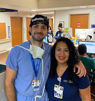 Dr. Ohanisian and co-worker at reception desk in hospital