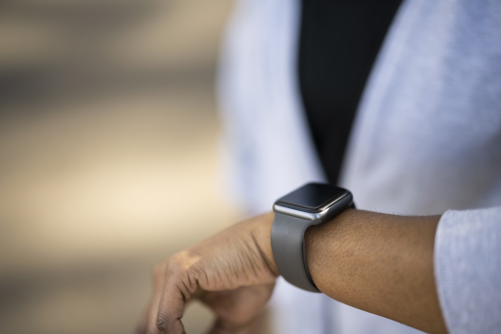 A person's arm wearing a smartwatch